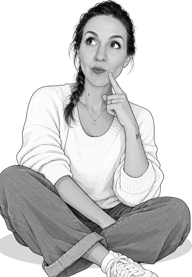 Julie Arrouet, assise, songeuse, un doigt sur la joue